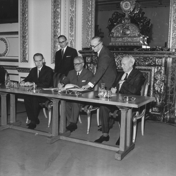 British Foreign Secretary Michael Stewart, seated between ambassadors from the Soviet Union (left) and the United States (right), signs the nuclear Nonproliferation Treaty at Lancaster House in London on July 1, 1968, the day the accord opened for signature. In total, 58 countries signed the treaty that day. There are now 191 states-parties to the NPT. (Photo credit: Jim Gray/Keystone/Getty Images)