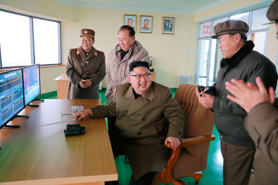 North Korean leader Kim Jong Un visits the Sohae Satellite Launching Station for a test of a new high-thrust rocket engine in a photo released by the state-run Korean Central News Agency on March 19. (Photo credit: STR/AFP/Getty Images)