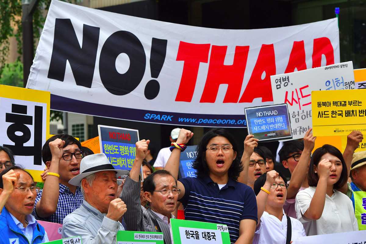 South Korean activists hold a rally July 11, 2016 in Seoul against the U.S. Terminal High Altitude Area Defense (THAAD) system. Under an agreement with the South Korean government, U.S. deployment of the system began in March. Credit: Jung Yeon-Je/AFP/Getty Images