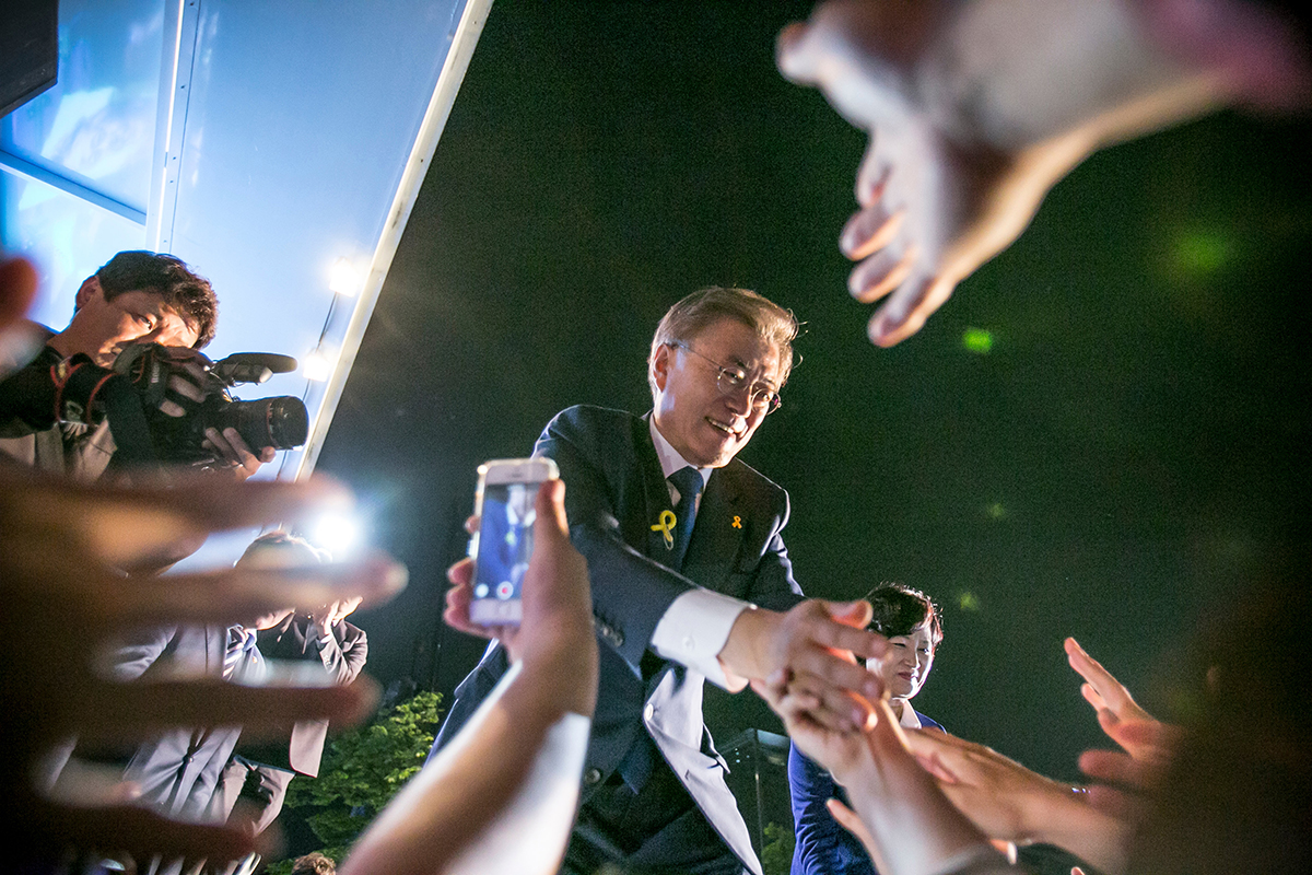 Newly elected South Korean President Moon Jae-in greets supporters in Seoul after his victory was confirmed May 9. (Photo credit: Jean Chung/Getty Images)