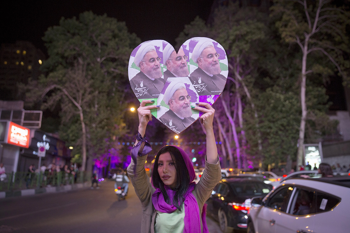 A supporter of Iranian President Hassan Rouhani, who backed the nuclear deal with world powers, celebrates in Tehran after he won the presidential election on May 20. (Photo credit: Majid Saeedi/Getty Images)