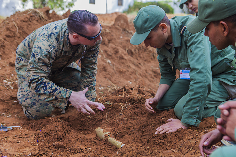 A U.S. Marine with Special Purpose Marine Air-Ground Task Force-Crisis Response-Africa 19.2, Marine Forces Europe and Africa, discusses explosive ordnance identification procedures with a member of the Moroccan Royal Armed Forces during training at Unite de Secours et Sauvetage’s Base, Kenitra, Morocco, April 22, 2019. (Photo: U.S. Marine Corps)