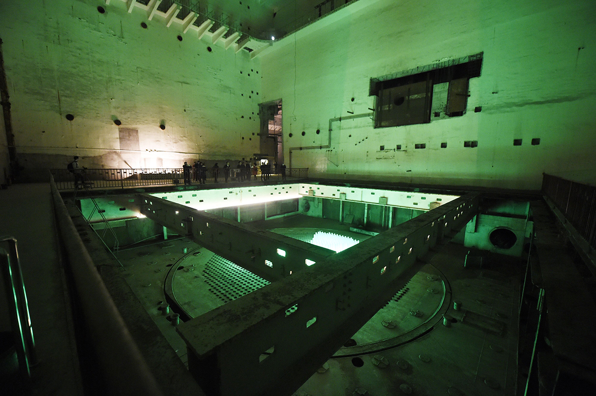 Visitors tour China’s once-secret 816 Nuclear Military Plant, a vast underground facility that had been intended to contain a reactor producing weapons-usable plutonium. The project was cancelled in 1984, before completion, and the complex of caves and tunnels was opened as a tourist site in 2010. This photo taken February 21 shows the room that was to house the reactor. (Photo credit: Wang Zhao/AFP/Getty Images)