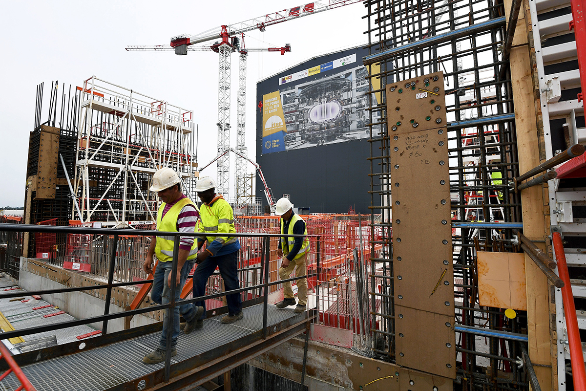 Technicians work at the construction site of the International Thermonuclear Experimental Reactor (ITER), a multinational nuclear fusion project, in Saint-Paul-les-Durance, France, on October 6, 2016. The UK’s withdrawal from Euratom jeopardizes its participation in the megaproject. (Photo credit: Christine Poujoulay/AFP/Getty Images)