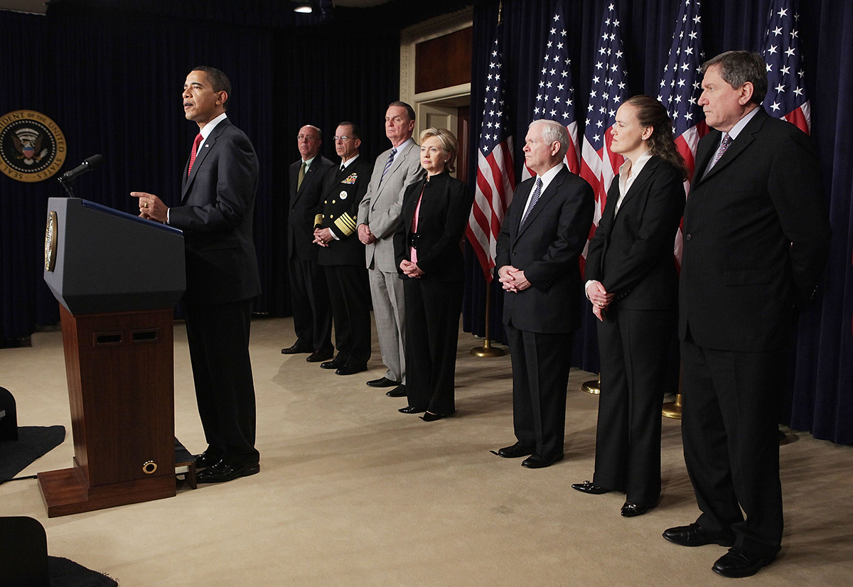 Michèle Flournoy stands with other senior members of President Barack Obama’s national security team as he speaks about Afghanistan in the Eisenhower Executive Office Building March 27, 2009. (Photo credit: Mark Wilson/Getty Images)