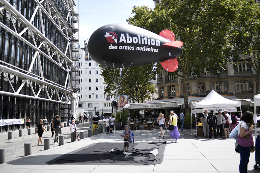 A balloon shaped like a nuclear bomb floats outside the Centre Georges Pompidou in Paris on August 7, as part of an effort to press France to sign the new UN treaty to prohibit nuclear weapons. France and other nuclear-weapons states, including the United States and Russia, did not participate in the negotiations and oppose the treaty. (Photo credit: Stephane De Sakutin/ Getty Images) A balloon shaped like a nuclear bomb floats outside the Centre Georges Pompidou in Paris on August 7, as part of an effort to press France to sign the new UN treaty to prohibit nuclear weapons. France and other nuclear-weapons states, including the United States and Russia, did not participate in the negotiations and oppose the treaty. (Photo credit: Stephane De Sakutin/ Getty Images)