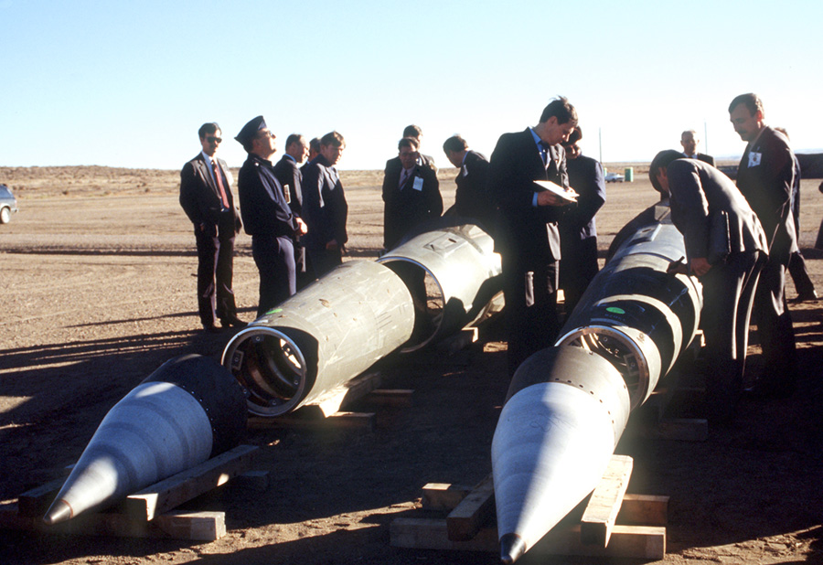 Soviet inspectors and their American escorts stand January 14, 1989 among several dismantled U.S. Pershing II missiles as they view the destruction of other missile components. The missiles are being destroyed in accordance with the Intermediate-Range Nuclear Forces (INF) Treaty. (Photo credit: MSGT Jose Lopez Jr./U.S. Department of Defense)