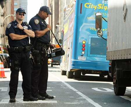 New York City police officers use a radiation detection device to monitor traffic August 11, 2007 in response to an unverified report of a terrorist plot to detonate a radiological device in the city. (Photo credit: Mario Tama/Getty Images)