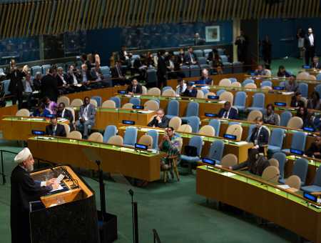 Iranian President Hassan Rouhani addresses the UN General Assembly Sept. 20. The nuclear deal “constitutes a recognized multilateral agreement, and any failure on the part of the United States in implementing it would constitute an international wrongful act and would be objected to by the international community,” he said.  (Photo credit: Kevin Hagen/Getty Images)