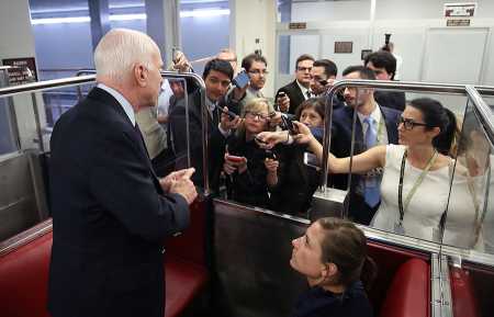 Sen. John McCain (R-Ariz.) speaks to reporters in the Senate subway Sept. 18 before the Senate takes up the National Defense Authorization Act for fiscal year 2018. (Photo credit: Mark Wilson/Getty Images)