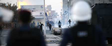 Shiite protesters in Bahrain clash with riot police following a funeral April 5, 2016. (Photo credit: Mohammed Al-Shaikh/AFP/Getty Images)