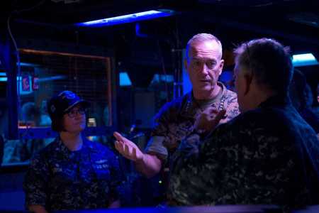 Marine Gen. Joseph F. Dunford, chairman of the Joint Chiefs of Staff, discusses ballistic missile defense capabilities with Lt. Cmdr. Brian Gauthier in the combat information center aboard the Arleigh Burke-class guided-missile destroyer USS Barry on September 7.  (Photo credit: U.S. Navy photo/Mass Communication Specialist 2nd Class Kevin V. Cunningham)