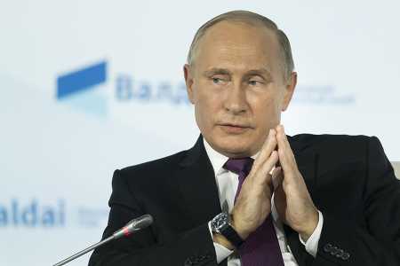 Russian President Vladimir Putin gestures as he speaks during the annual Valdai Club conference of international experts in Sochi on October 19. (Photo credit: ALEXANDER ZEMLIANICHENKO/AFP/Getty Images)