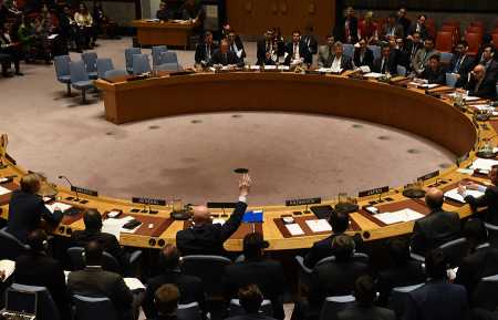 Russian Ambassador Vassily Nebenzia casts a veto of a UN Security Council resolution to extend investigations into who is responsible for chemical weapons attacks in Syria, on October 24 at the United Nations.  (Photo credit: TIMOTHY A. CLARY/AFP/Getty Images)