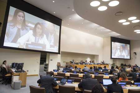 Costa Rican Ambassador Elayne Whyte Gómez (shown on screens), permanent representative to the UN Office at Geneva, in a June 15 photo, led the negotiation conference that produced the nuclear weapons prohibition treaty. Still, more than two-thirds of the conference delegates were male, and almost a third of the 121 registered country delegations were exclusively male.  (Photo credit: Eskinder Debebe/United Nations)