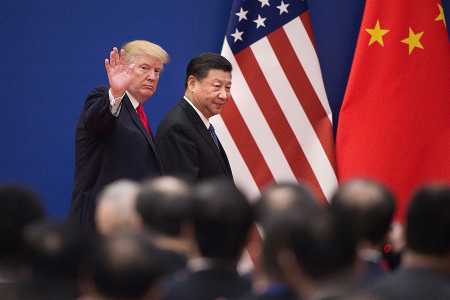 U.S. President Donald Trump and Chinese President Xi Jinping leave a business leaders event at the Great Hall of the People in Beijing on November 9.   (Photo credit: NICOLAS ASFOURI/AFP/Getty Images)