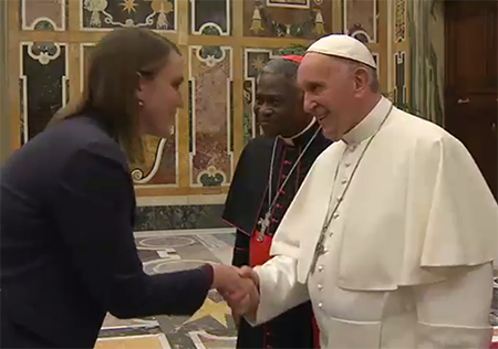 Pope Francis greets ACA's Director for Nonproliferation Policy Kelsey Davenport at the Vatican's 2017 nuclear disarmament conference.
