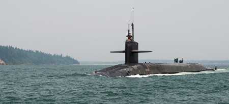 The Ohio-class ballistic-missile submarine USS Pennsylvania transits the Hood Canal August 2, 2017, as it returns home to Naval Base Kitsap-Bangor, Wash. A submarine on patrol could launch its nuclear missiles as quickly as 15 minutes after a president gives the command. (Photo: Amanda Gray/ USSTRATCOM)