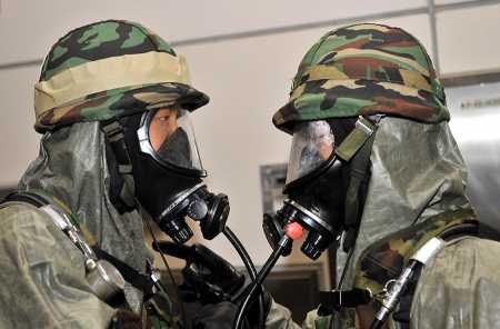 South Korean military biochemical-warfare soldiers talk during an anti-terror exercise in Seoul on August 17, 2011. (Photo: JUNG YEON-JE/AFP/Getty Images)