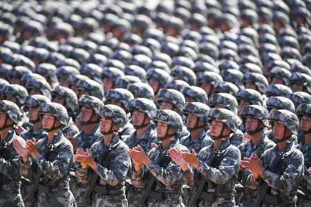 Chinese soldiers applaud during a military parade at the Zhurihe training base in China's northern Inner Mongolia region on July 30, 2017. The U.S. Nuclear Posture Review says China’s military modernization “has resulted in an expanded nuclear force, with little to no transparency into its intentions.” (Photo: STR/AFP/Getty Images)