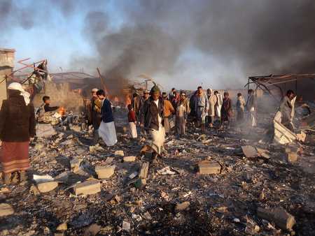 Yemenis inspect the damage at the site of air strikes in the Houthi-held city of Saada on January 6. (Photo: STRINGER/AFP/Getty Images)