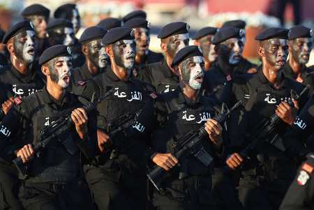 Members of Qatar's armed forces march in national day celebrations December 18, 2017. The parade reportedly included a previously unseen, Chinese-made short-range ballistic missile system.  (Photo: STRINGER/AFP/Getty Images)