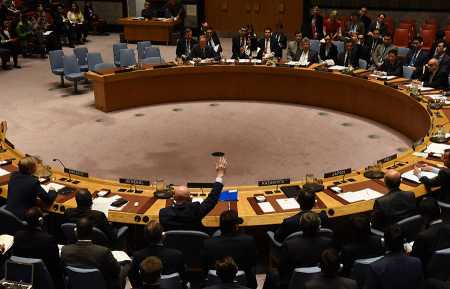 Russian Ambassador to the UN Vassily Nebenzia (raising his hand) votes October 24, 2017 to block the extension of the Security Council mandate authorizing the Joint Investigative Mechanism and the Organisation for the Prohibition of Chemical Weapons to determine the perpetrators of chemical-weapons attacks in Syria. (Photo: TIMOTHY A. CLARY/AFP/Getty Images)