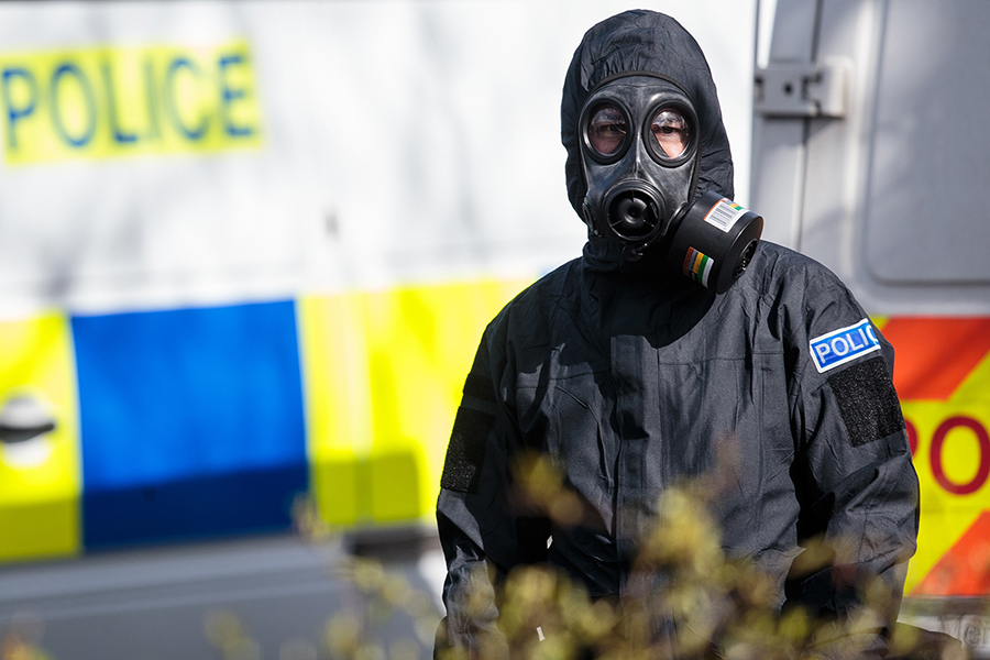A police officer in a protective suit and mask works near the scene where former double-agent Sergei Skripal and daughter Yulia were found after being attacked with a nerve agent on March 16, 2018 in Salisbury, UK. (Photo: Jack Taylor/Getty Images)