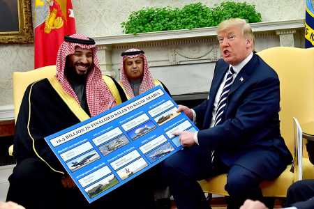 President Donald Trump holds up a chart highlighting U.S. military hardware sales to Saudi Arabia as he meets with Saudi Crown Prince Mohammed bin Salman in the Oval Office on March 20.  (Photo: Kevin Dietsch-Pool/Getty Images)