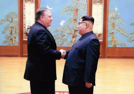North Korean leader Kim Jong Un shaking hands with then-CIA Director Mike Pompeo in April. (Photo by The White House via Getty Images)
