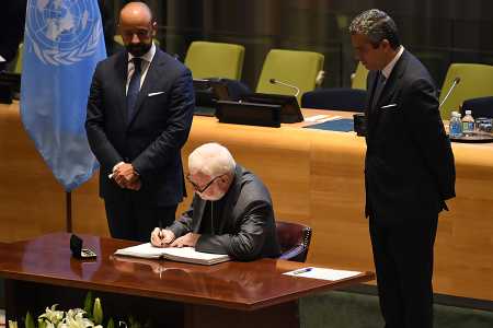 Archbishop Paul Richard Gallagher, the Holy See's secretary for Relations with States, signs the Treaty on the Prohibition of Nuclear Weapons, at the United Nations on September 20, 2017.  At the same time, he handed over the instrument of ratification. (Photo: Darren Ornitz/ICAN)