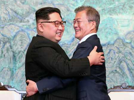 North Korean leader Kim Jong Un (L) and South Korean President Moon Jae-in (R) embrace after signing the Panmunjom Declaration during their Inter-Korean Summit on April 27 at the Peace House in Panmunjom, South Korea.  (Photo: Korea Summit Press Pool/Getty Images)