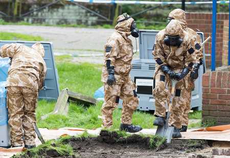 Members of the UK military work April 24 in Salisbury, England near the spot where Russian former double agent Sergei Skripal and his daughter Yulia became critically ill several weeks earlier due to exposure to a Russian nerve agent.   (Photo: Matt Cardy/Getty Images)