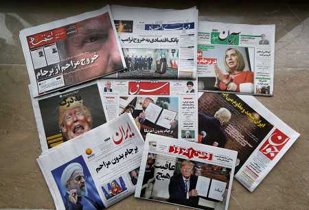 Newspapers in Tehran on May 9 headline the U.S. withdrawal from the nuclear deal. (Photo:  Atta Kenare/AFP/Getty Images)