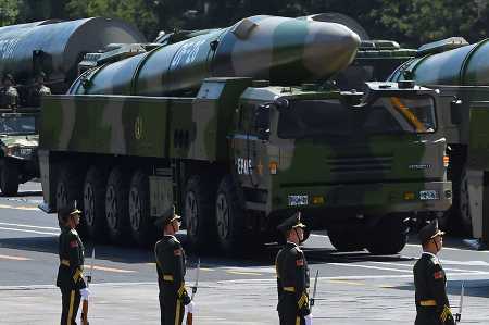 Military vehicles carrying China’s DF-26 ballistic missiles are displayed at Tiananmen Square in Beijing on September 3, 2015 during a military parade to mark the 70th anniversary of victory over Japan and the end of World War II. (Photo: Greg Baker/AFP/Getty Images)