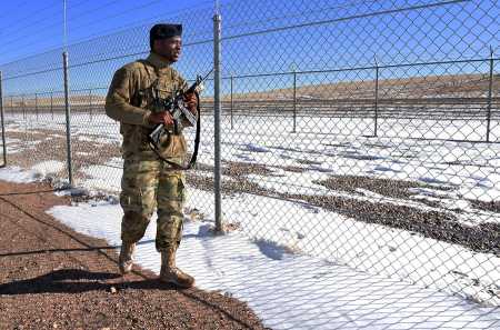A member of the U.S. Air Force 90th Security Forces Squadron patrols the fence in the weapons storage area at F.E Warren Air Force Base, Wyo., on January 26. The Associated Press reported on a drug ring that operated on the base in 2016. (Photo: Breanna Carter/U.S. Air Force)