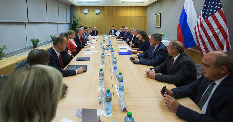 U.S. (L) and Russian delegations face one another as John Bolton, the U.S. national security adviser, holds talks with Russian Security Council Secretary Nikolai Patrushev on August 23 in Geneva. (Photo: Eric Bridiers/U.S. Mission)