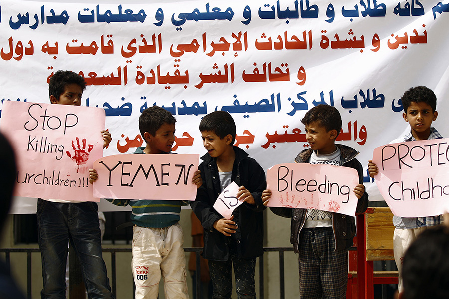 Yemeni children raise protest signs during a demonstration in the capital Sanaa on August 12, after an air strike by the U.S.-backed, Saudi-led military coalition hit a school bus and reportedly killed more than 40 children in the northern Houthi stronghold of Saada. (Photo: Mohammed Huwais/AFP/Getty Images)