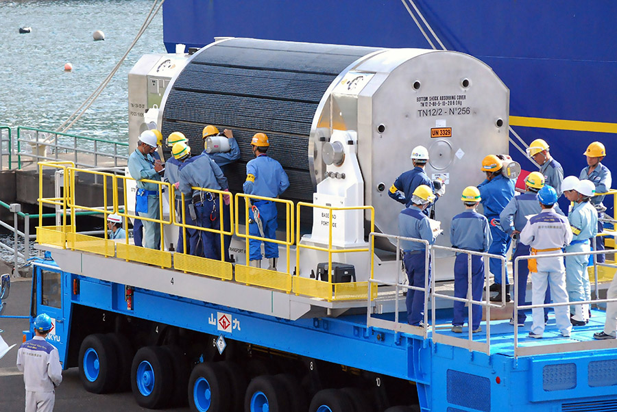 Workers of Kansai Electric Power Co. (KEPCO) check a mixed-oxide (MOX) fuel container after it was unloaded from a vessel at the KEPCO's Takahama nuclear power plant in Fukui prefecture June 27, 2013. (Photo: Kazuhiro Nogi/AFP/Getty Images)