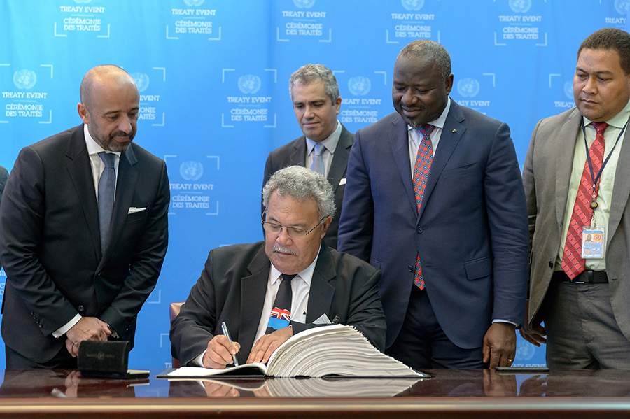 CTBTO Executive Secretary Lassina Zerbo (2nd from right) looks on as the prime minister of Tuvalu, Enele Sopoaga, signs the Comprehensive Test Ban Treaty on September 25.  With the addition of Tuvalu, the number of signatory states grew to 184. Thailand became the 167th country to ratify the CTBT. (Photo: CTBTO)