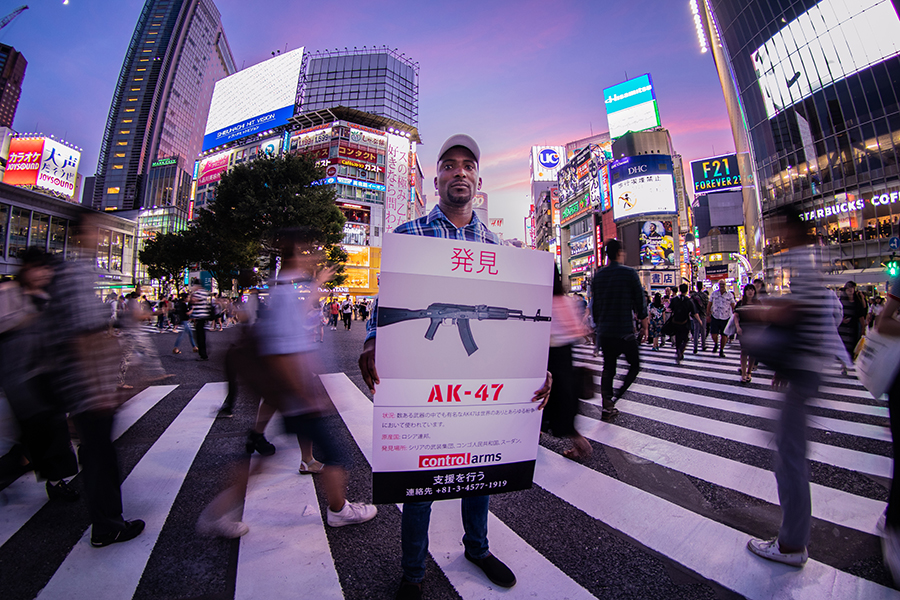 Morning commuters and delegates arriving for the fourth conference of states-parties to the Arms Trade Treaty (ATT), held in Tokyo, were met by campaigners holding “missing” posters illustrating real-life cases of weapons that have been diverted into the illicit trade. (Photo: Control Arms)