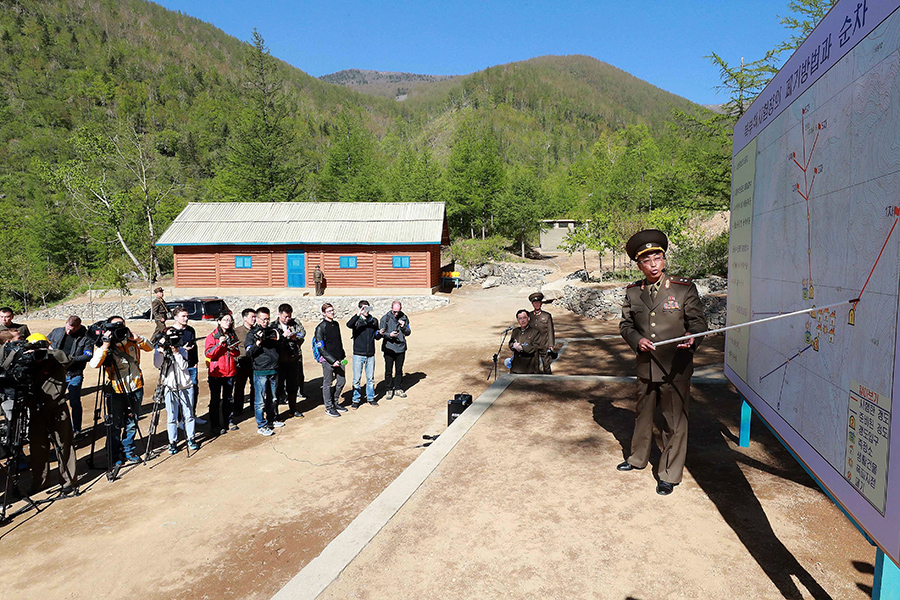 A North Korean officer on May 24 explains to the invited international journalists the explosive demolition process undertaken to disable the Punggye-ri nuclear test facility. However, verification that the site is no longer usable for underground nuclear tests requires technical expertise and sophisticated analysis equipment. (Photo: News1-Dong-A Ilbo via Getty Images)