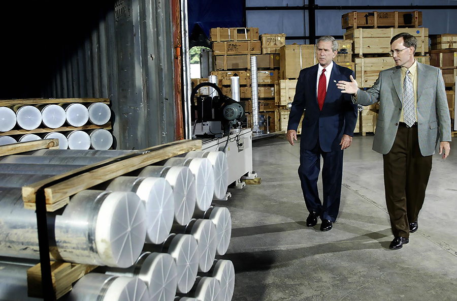 U.S. President George W. Bush, during a 2004 tour of Oak Ridge National Laboratory in Tennessee, is shown nuclear-related materials and equipment surrendered by Libya. Under pressure from the United States, Libya dismantled its nuclear weapons infrastructure in 2003–4. More than 55,000 pounds of Libyan nuclear equipment and documents were shipped from Libya and to Oak Ridge. (Photo: Tim Sloan/AFP/Getty Images)
