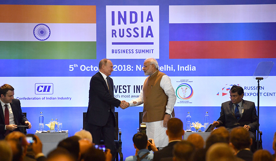 Russian President Vladimir Putin shakes hands with Indian Prime Minister Narendra Modi at the India-Russia Business Summit in New Delhi on October 5.  (Photo: Yuri Kadobnov/AFP/Getty Images)