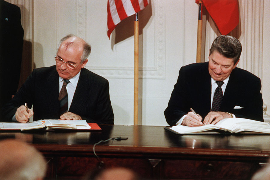 Soviet Leader Mikhail Gorbachev and President Ronald Reagan sign the Intermediate-Range Nuclear Forces (INF) Treaty in the East Room of the White House on December 8, 1987. (Photo: Corbis via Getty Images)