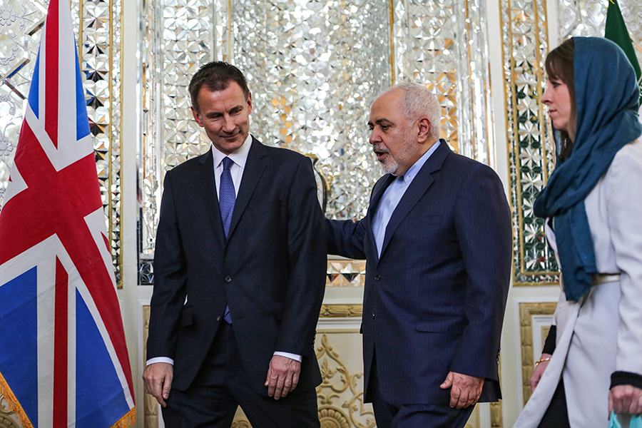 Iranian Foreign Minister Mohammad Javad Zarif talks with UK Foreign Secretary Jeremy Hunt in Tehran on November 19. The UK is among the countries seeking to soften the impact on Iran of renewed U.S. sanctions so that Tehran continues to comply with the Iran nuclear deal. (Photo: Atta Kenare/AFP/Getty Images )