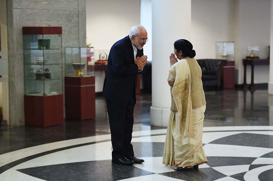 Indian Foreign Minister Sushma Swaraj greets to her Iranian counterpart Mohammad Javad Zarif before a meeting in New Delhi on May 28. Like the EU, India is resisting renewed U.S. sanctions on Iran. “India follows only UN sanctions, and not unilateral sanctions by any country,” she said at a news conference. (Photo: Money Sharma/AFP/Getty Images)