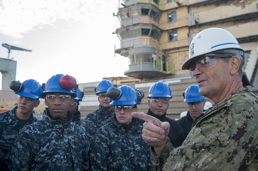 Admiral Bill Moran, the vice chief of naval operations, speaks with sailors assigned to the USS George Washington during a January 10 tour of the ship at the naval shipyard in Newport News, Va. The Nimitz-class aircraft carrier is undergoing a four-year overhaul that includes refueling of the ship's two nuclear reactors as well as significant repair, upgrades and modernization.  (Photo: Jamin Gordon/U.S. Navy)