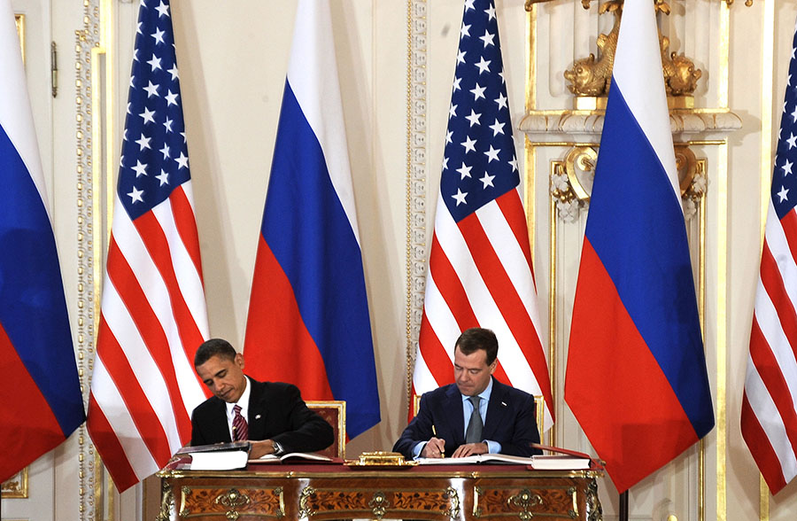 U.S. President Barack Obama and then-Russian President Dmitry Medvedev sign the 2010 New Strategic Arms Reduction Treaty (New START) in Prague on April 8, 2010, committing their nations to further nuclear arms cuts. (Photo: Joe Klamar/AFP/Getty Images)