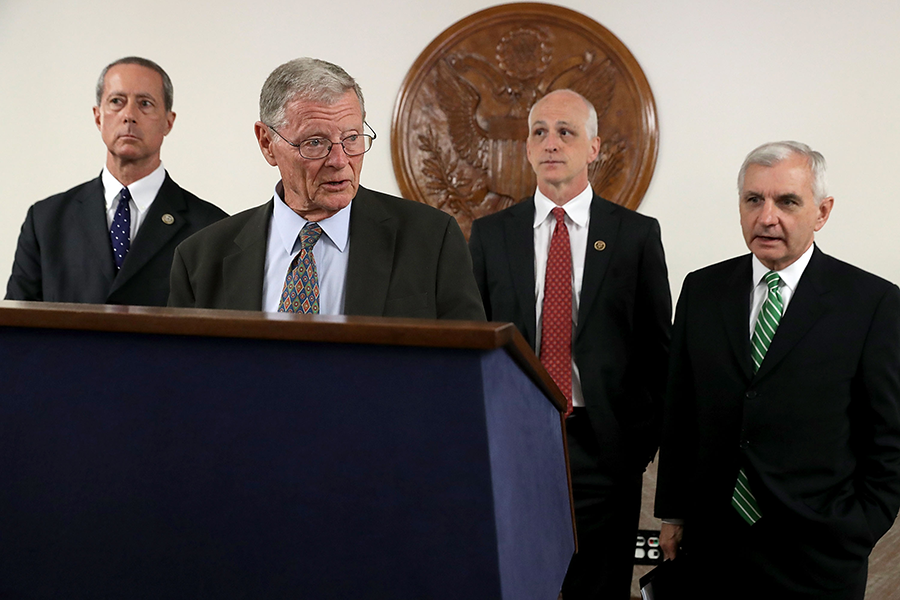 Sen. James Inhofe (R-Okla.) speaks to reporters about the fiscal year 2019 National Defense Authorization Act on Capitol Hill July 11, 2018, as Rep. Adam Smith (D-Wash.) looks on. In the new Congress, Inhofe is the chairman of the Senate Armed Services Committee, and Smith is the chairman of the House Armed Services Committee. (Photo: Chip Somodevilla/Getty Images)